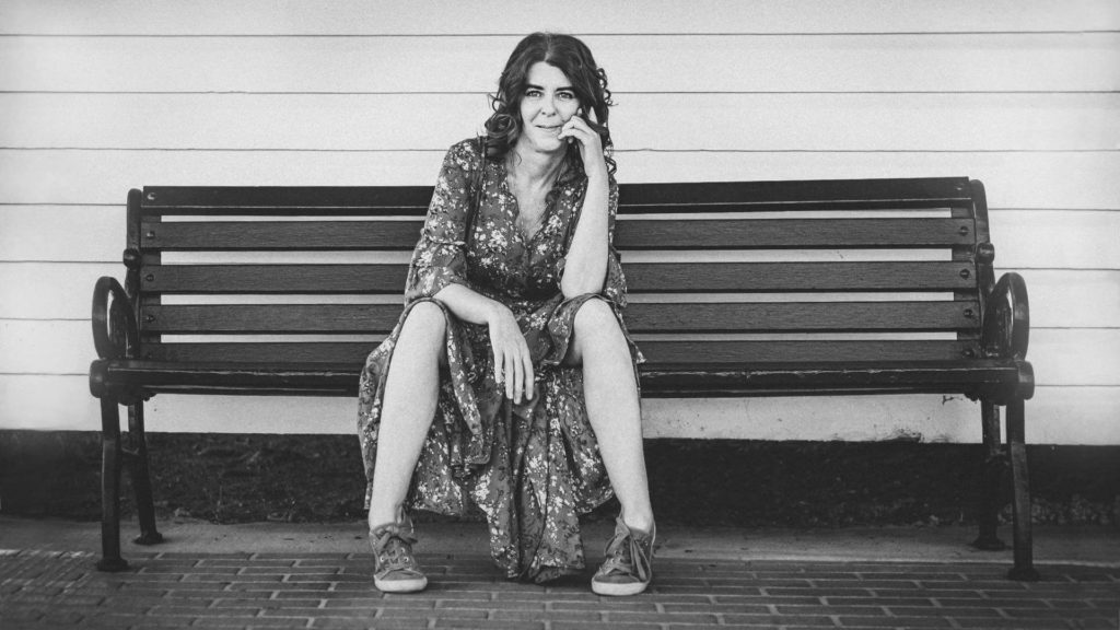 Lady sitting on a bench_large