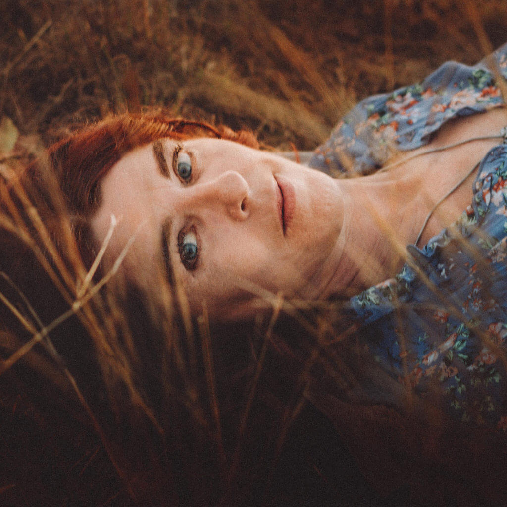 Lady in the grass_square